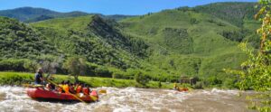 Two groups rafting down river