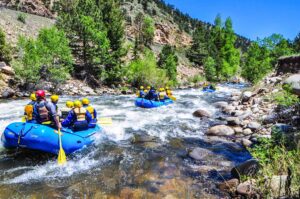 two groups of people rafting down river